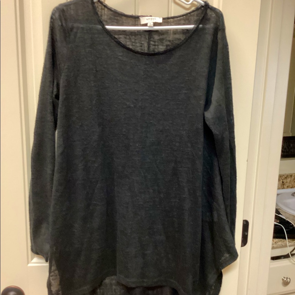 Tunic style cotton and polyester top.  Very stylish with unique hem.